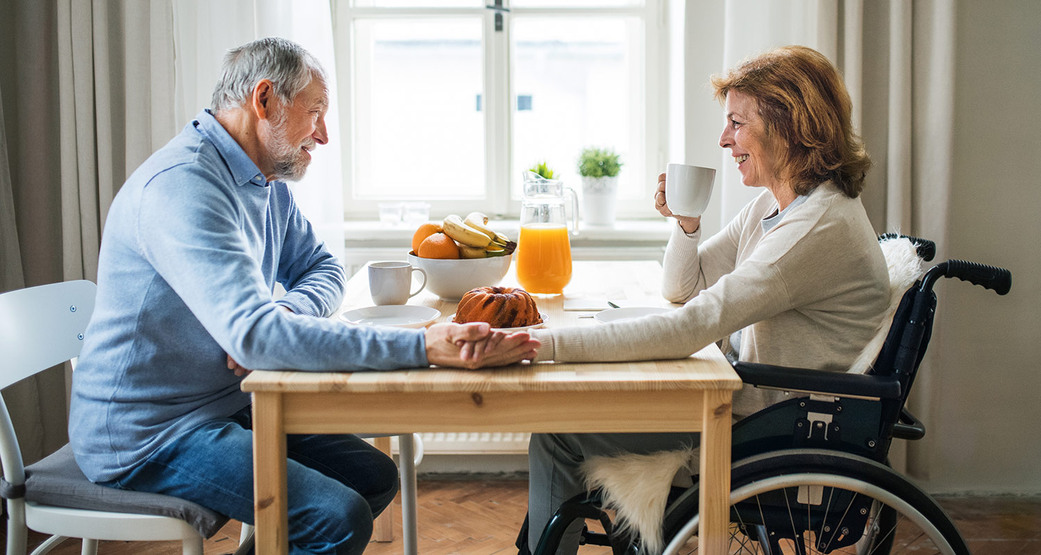 man and woman sitting at table