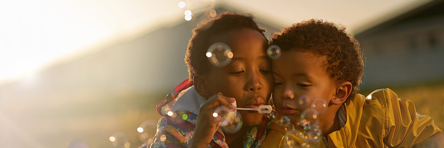 children blowing bubbles